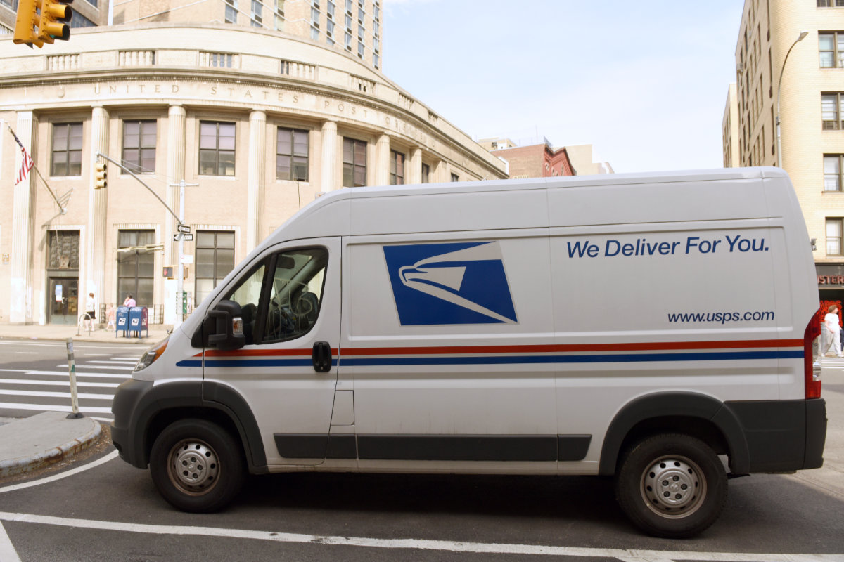 USPS delivery van parked in NYC