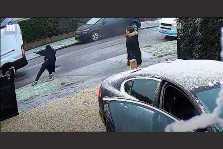 Video: Delivery Driver Trips Chasing His Van as it Rolls Down Icy Street