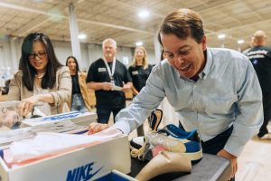 eBay CEO Jamie Iannone visiting New Jersey authentication center.